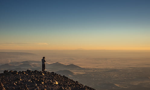 person standing on hill thumbnail