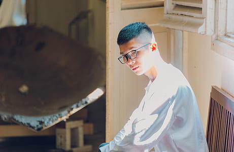 Man Wearing White Shirt Looking Down thumbnail