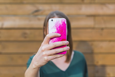 person holding phone thumbnail