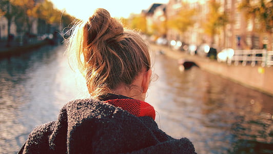 selective focus photography of woman's back thumbnail