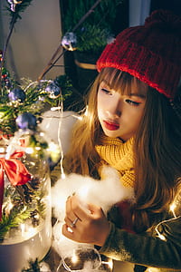 photo of woman holding string lights thumbnail