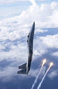 gray aircraft in mid-air at daytime thumbnail