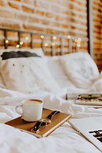Morning coffee in bed. Working in bed thumbnail