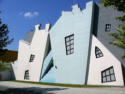 architectural photography of blue and white concrete house thumbnail