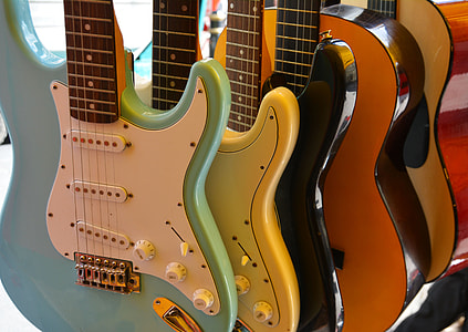 five assorted-color guitarts thumbnail
