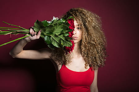 Woman Grasping Flowers Photo thumbnail