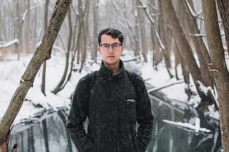 man standing in snow weather thumbnail