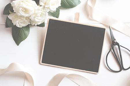 black scissor on white surface thumbnail