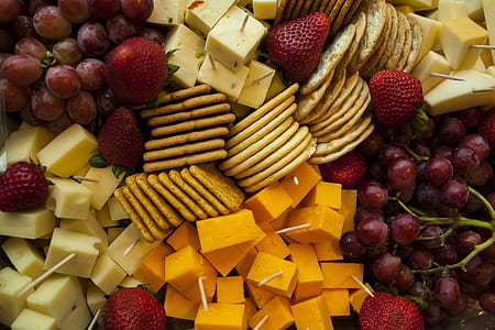 pile of biscuit, cheese, grapes, and strawberries high-angle closeup photo thumbnail