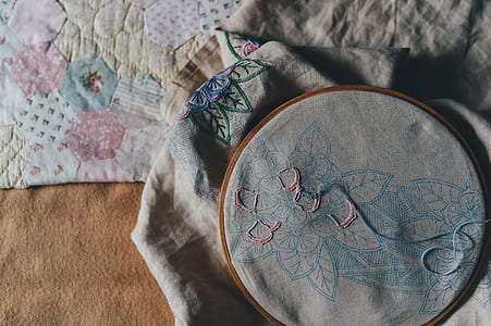 photo of gray and blue flower cross-stitch artwork thumbnail