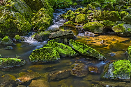 time lapse photography of river surrounded with rocks thumbnail
