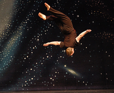 man doing acrobat with black and white background thumbnail
