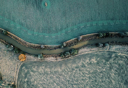 aerial photography of farm with river thumbnail