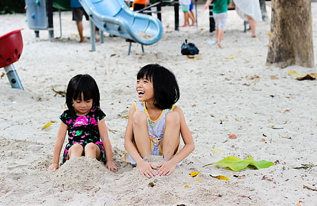 2 Girls Sitting on Seashore thumbnail