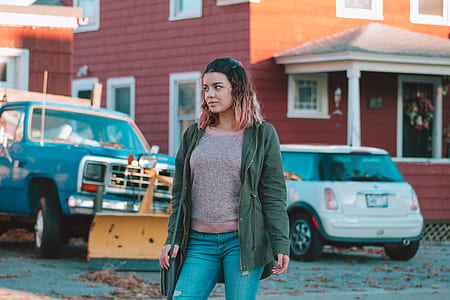 woman standing near vehicles thumbnail