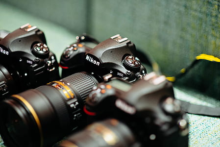 closeup photography of black Nikon DSLR cameras thumbnail