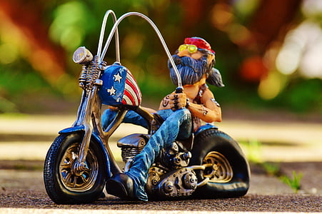 shallow focus photography of man on motorcycle figurine thumbnail