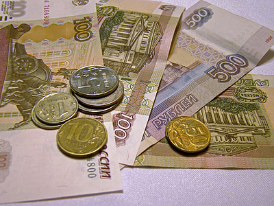 assorted-denomination Indian rupee coins and banknotes thumbnail
