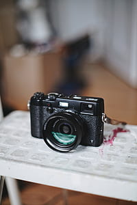 black DSLR camera thumbnail