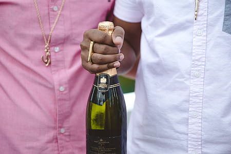 Friends celebrating with champagne outdoors thumbnail