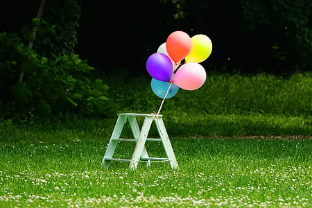 six balloons tied on 3-step table thumbnail