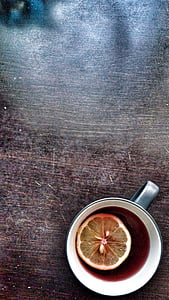 slice lemon on beverage serves on gray mug thumbnail