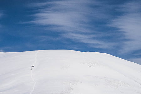 group of people hiking on snow mountain thumbnail