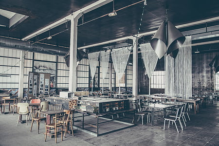 brown wooden chairs near black pendant lamp thumbnail