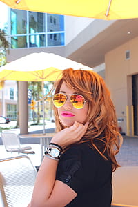 shallow focus photography of orange haired woman wearing aviator sunglasses thumbnail