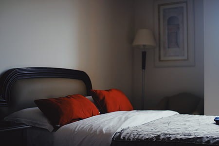 bed inside white painted bedroom thumbnail