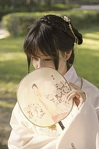 woman holding handfan thumbnail