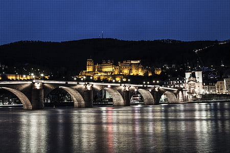 lighted gray concrete bridge at night thumbnail