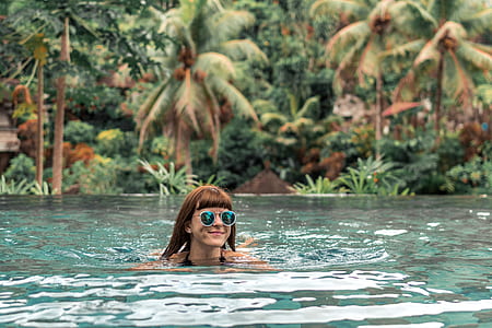 swimming woman during daytime thumbnail