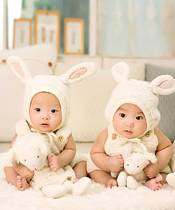 two babies in white rabbit costumes thumbnail