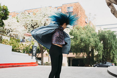 woman in black pants dancing during daytime thumbnail