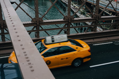 yellow car on bridge thumbnail