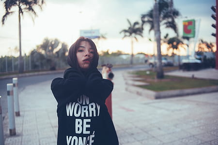 Woman Wearing Black Hoodie during Daytime thumbnail