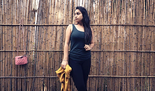 woman wearing black tank top and black leggings thumbnail