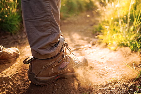 man standing near green grass field during daytime thumbnail
