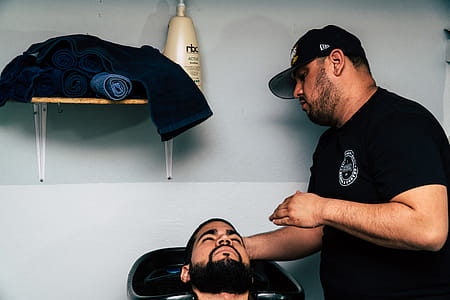 Man in Black Shirt Staring at Man thumbnail