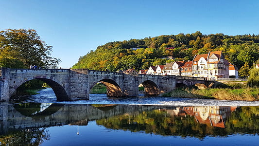 concrete bridge leading to a town thumbnail