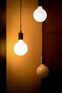 two turned-on pendant lamps thumbnail