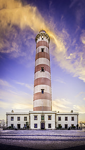 worm'sq eye view of a lighthouse during daytime thumbnail
