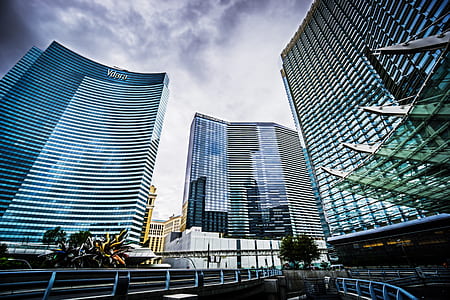 high-rise buildings under white clouds thumbnail