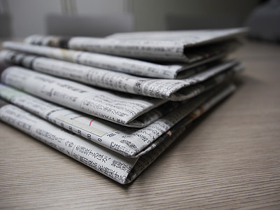 selective focus photography of newspapers thumbnail