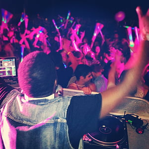 man raising his hand in front of crowd thumbnail