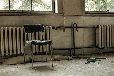 stainless steel chair near the radiator heater thumbnail
