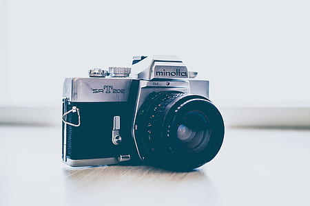 shallow focus photography of black and silver Minolta SLR camera thumbnail