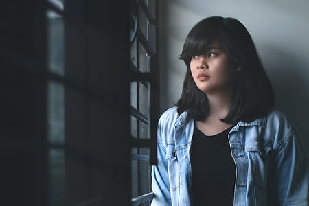 Woman in Blue Denim Jacket Indoors thumbnail