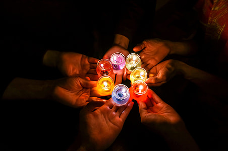 person's holding seven assorted-color candles thumbnail